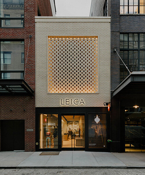 brick-screen facade highlights leica store & gallery in revitalized 1950s NYC meat market