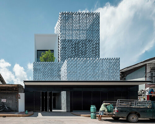 ayutt & associates' salient house is surrounded with glass block fence in thailand