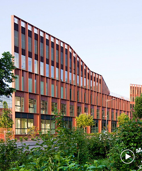 brenac & gonzalez & associés fronts wave-like building with vertical metal slats in france